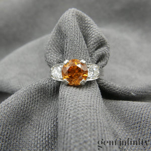 Bague or gris, zircon brun et diamants