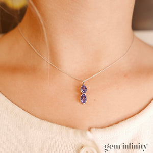 Pendentif or gris gouttes de tanzanites, chaîne