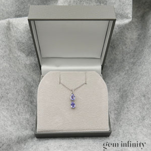 Pendentif or gris gouttes de tanzanites, chaîne