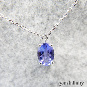 Collier or gris, tanzanites et diamants