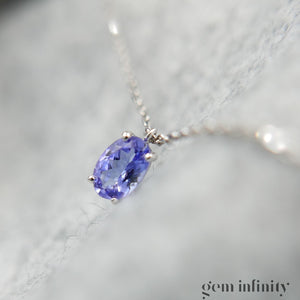 Collier or gris, tanzanites et diamants