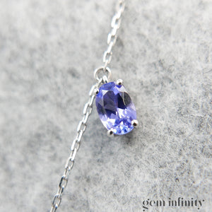 Collier or gris, tanzanites et diamants