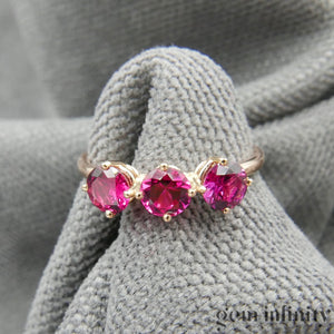 Bague or rose et rubis