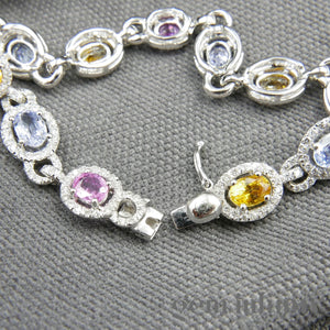 Bracelet or gris, saphirs de couleurs et diamants