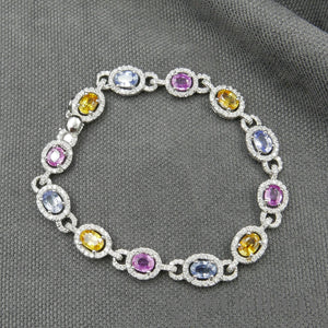 Bracelet or gris, saphirs de couleurs et diamants