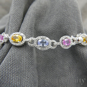 Bracelet or gris, saphirs de couleurs et diamants