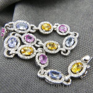 Bracelet or gris, saphirs de couleurs et diamants