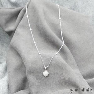 Collier pendentif or gris et diamants