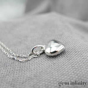 Collier pendentif coeur or gris et diamants