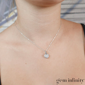 Collier pendentif coeur or gris et diamants