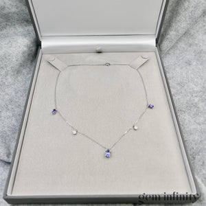 Collier or gris, tanzanites et diamants